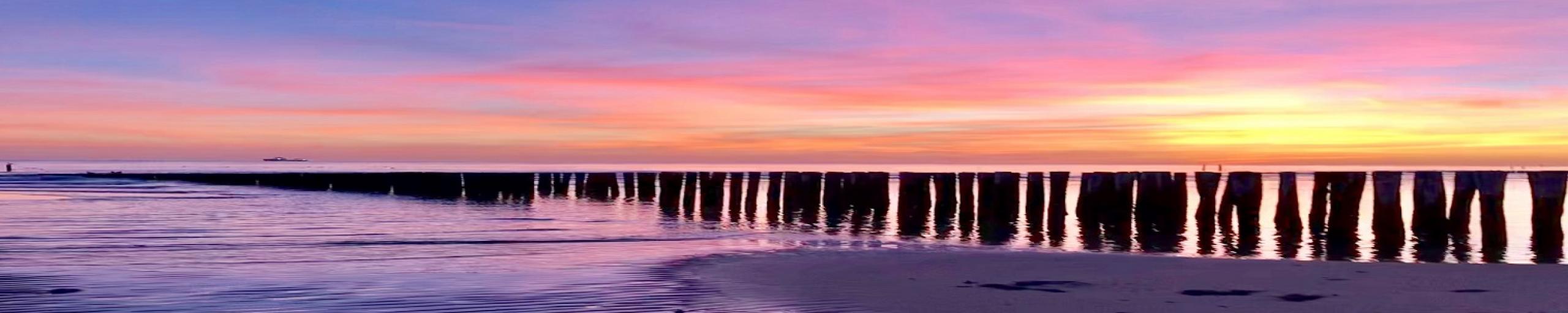 ondergaande zon strand foto Arienne Molenaar